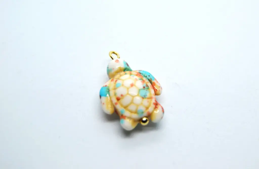 Coloured stone turtle charm