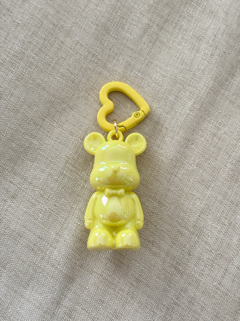 Yellow teddy bear charm