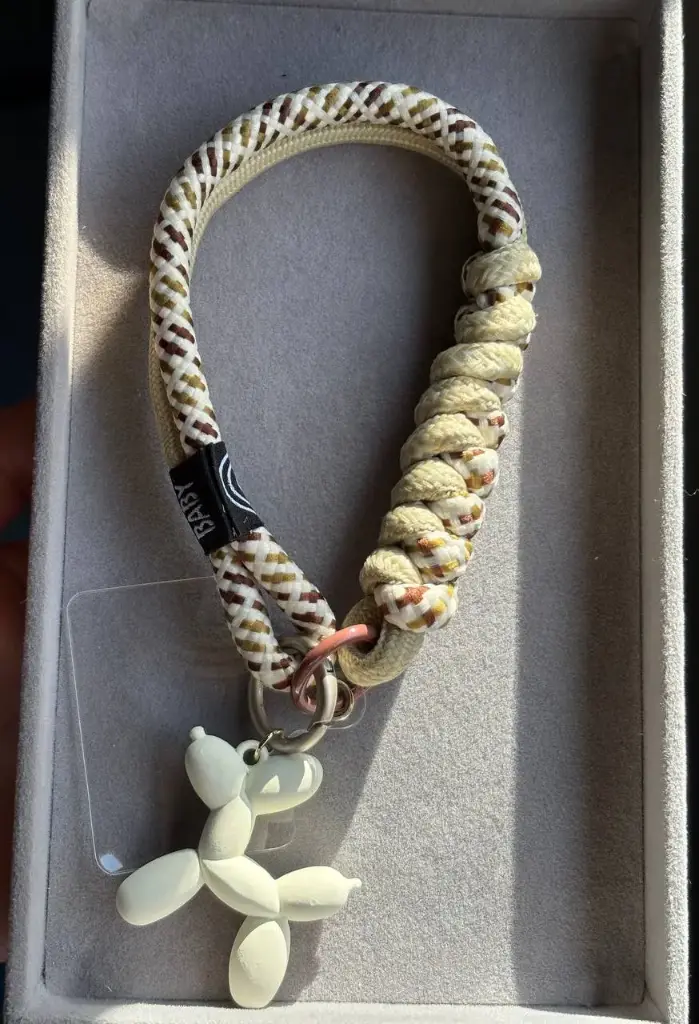 Bage phone holder with dog charm