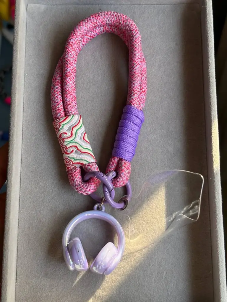 Pink and purple phone holder with one charm