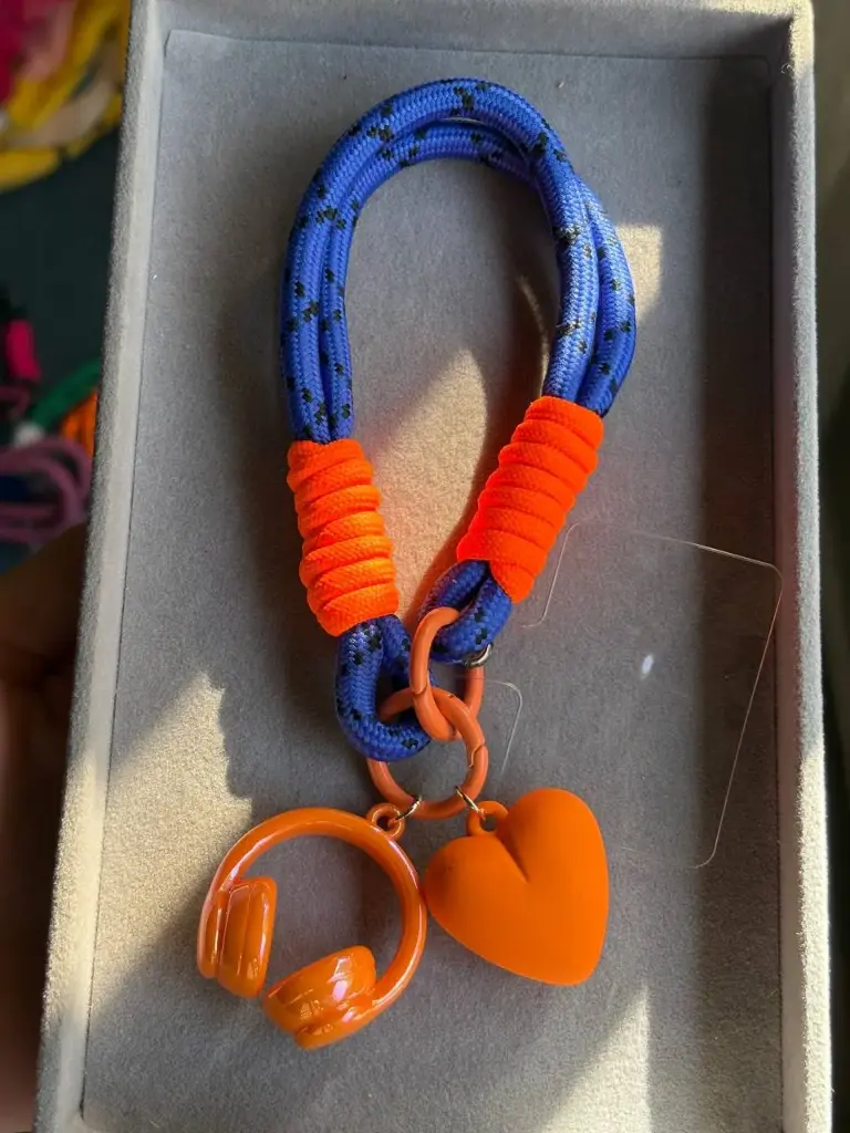 Mix blue and orange phone holder with 2 charms