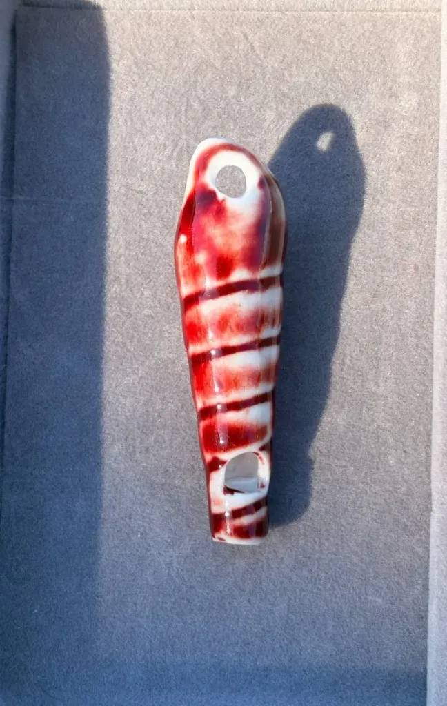 Red horn shell charm